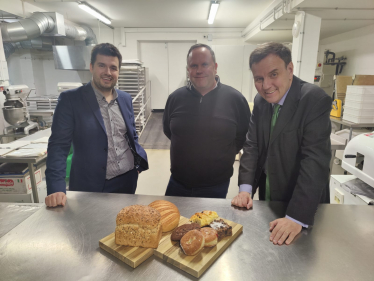 Elliot and Greg Hands MP meeting the Village Bakers Team