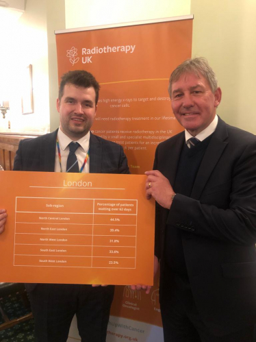 Elliot with former England footballer Bryan Robson at the Radiotherapy UK event.
